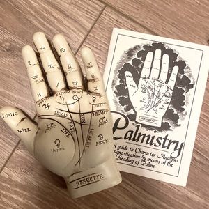 Palmistry hand and book